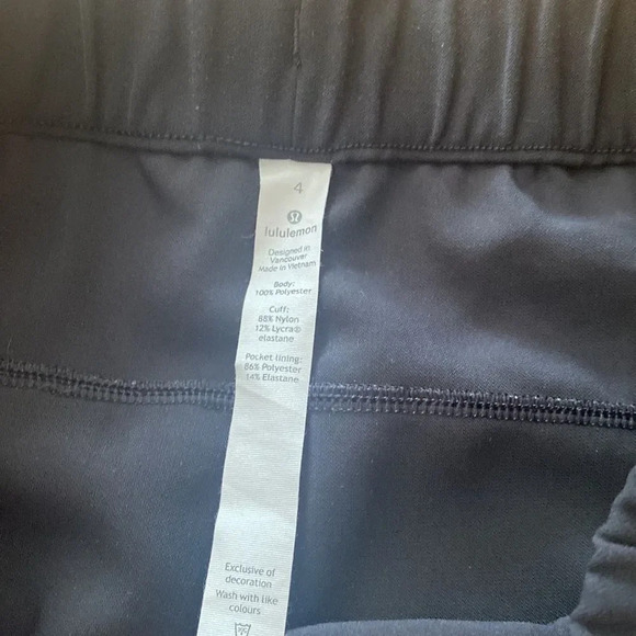 Lululemon On The Fly Pant *28" black pockets elastic waist + tie stretch ankle - Picture 6 of 9